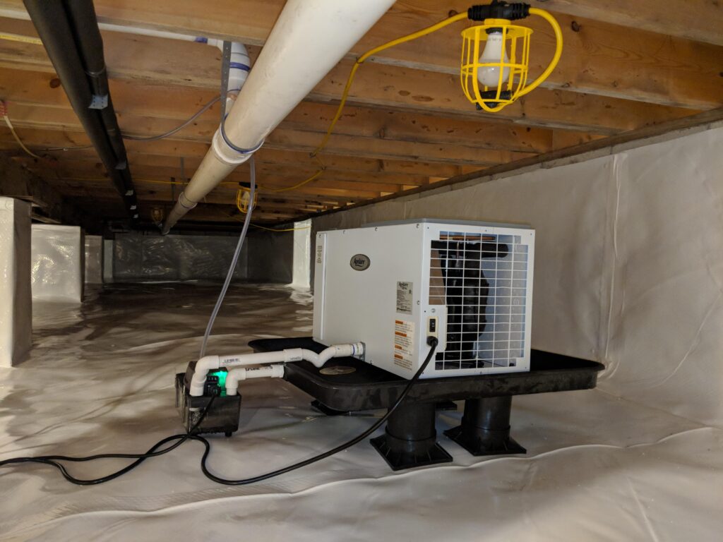 A Machine Inside a Crawl Space | Crawl Space Services